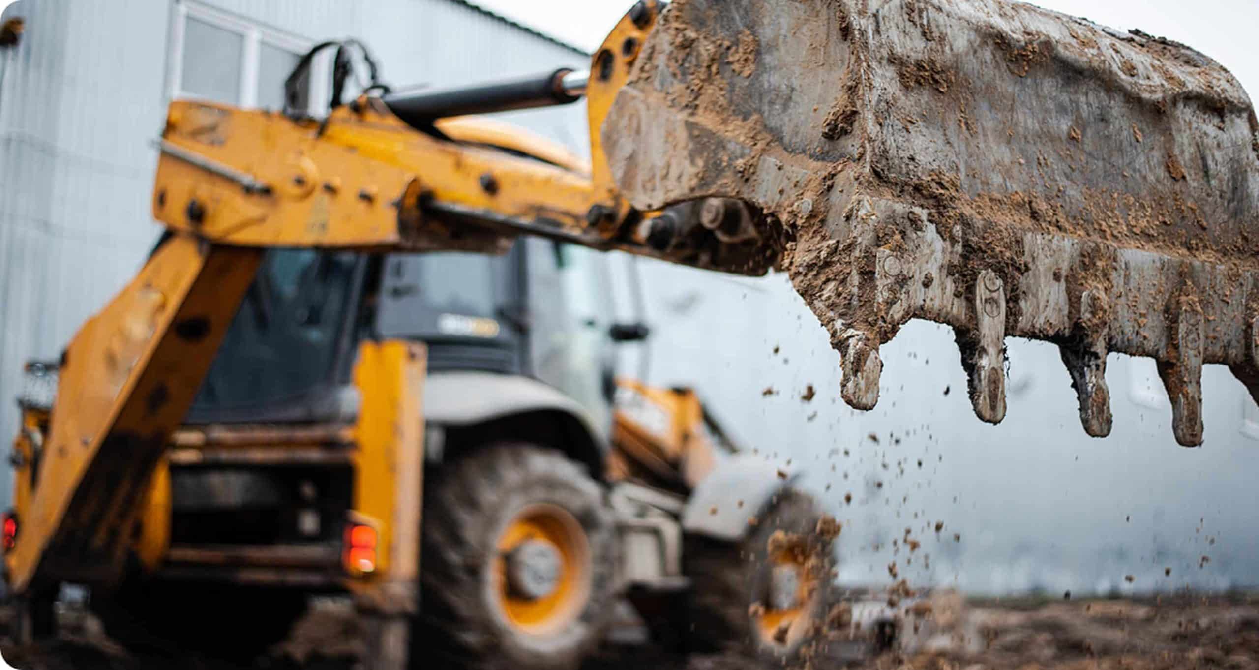 Graafmachine bezig met grondverzet op bouwproject van De Bruijn Lopik